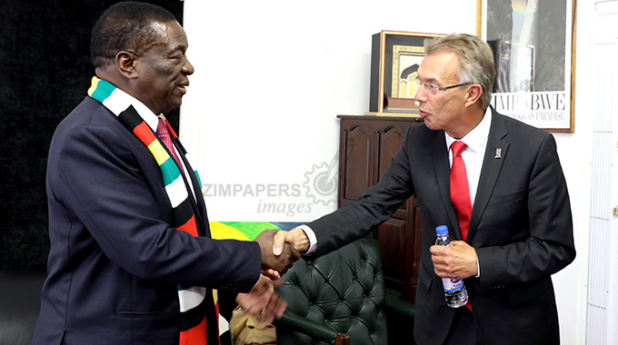 CIMMYT's director general Martin Kropff (right) greets the president of Zimbabwe, Emmerson Mnangagwa, at Munhumutapa Offices in Harare. (Picture by Tawanda Mudimu)