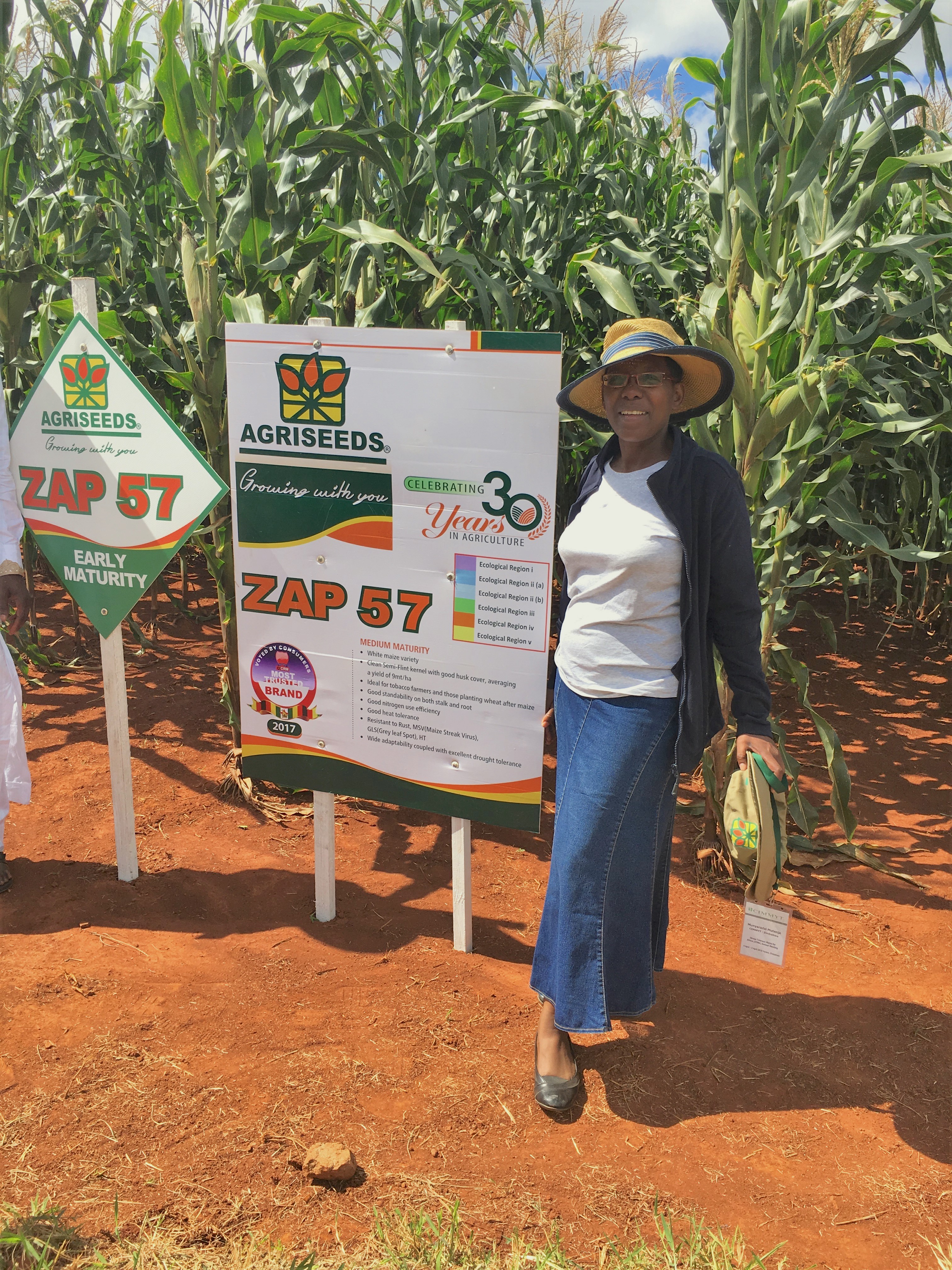 Mutenje stands next to a demonstration plot of maize during a field day organized by CIMMYT and Agriseeds. (Photo: CIMMYT)