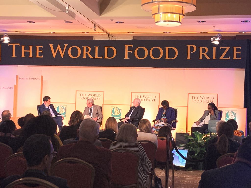 The Executive Director of CGIAR, Elwyn Grainger-Jones (left), 2019 World Food Prize Laureate, Simon Groot (second from left) and other speakers present CGIAR's Crops to End Hunger initiative. (Photo: Mary Donovan/CIMMYT)