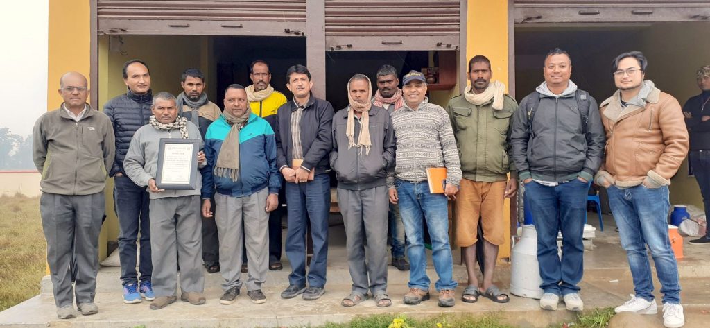 Dyutiman Choudhary (seventh from left) with seed producers during a field visit. (Photo: Dipak Kafle)