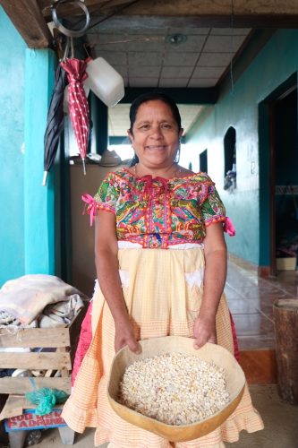 Felipa Martinez shows off some of her family’s maize from last year’s harvest. Photo: Matthew O’Leary