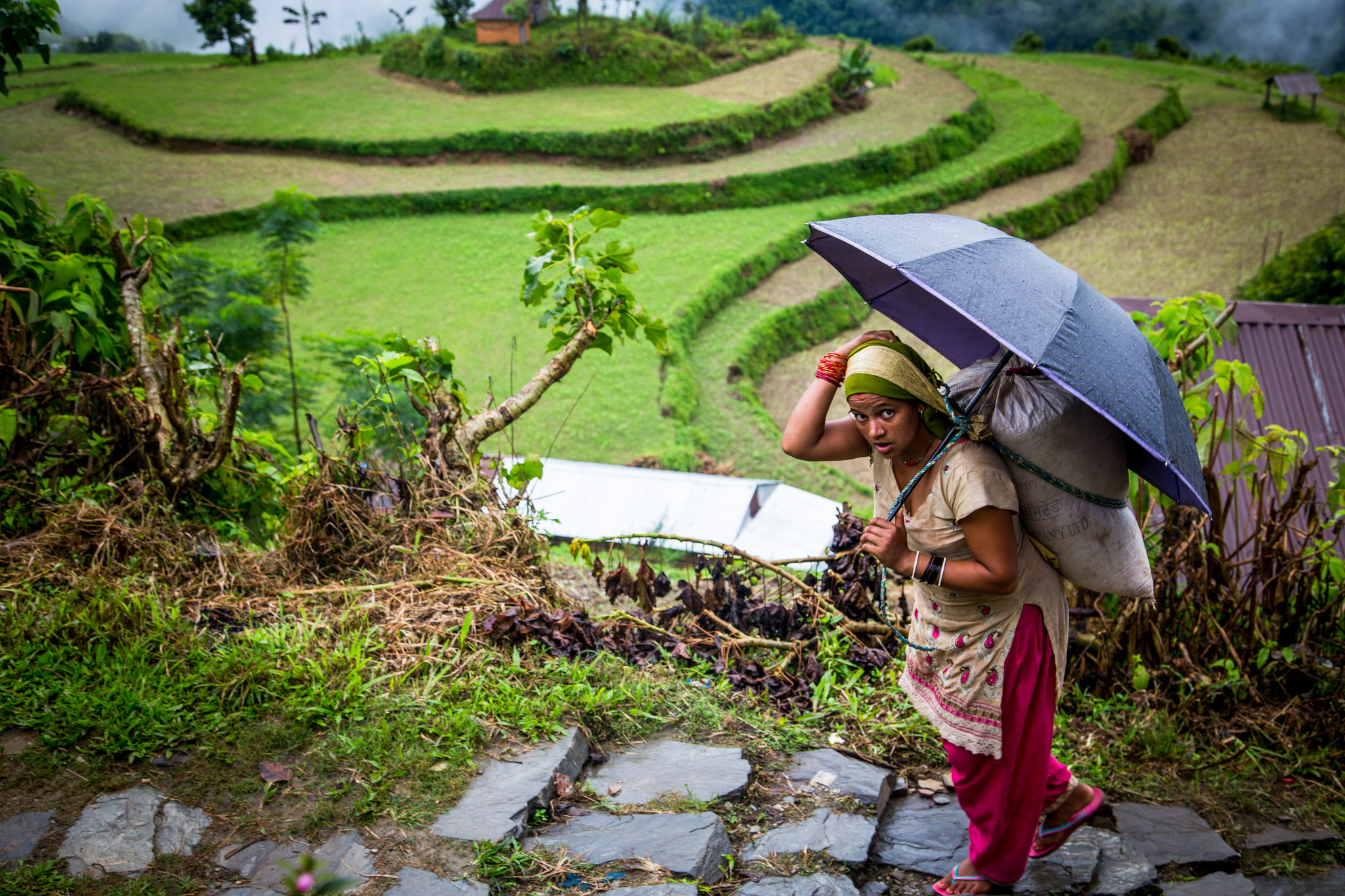 In the village of Nalma, Lamjung District, Nepal, most of the adult male population has gone abroad for work, leaving only children, women and the elderly. (Photo: Mokhamad Edliadi/CIFOR)