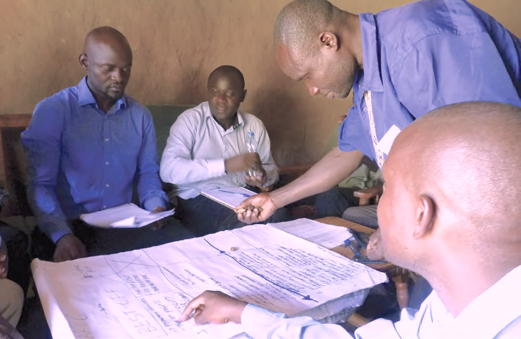 Men in Kenya participate in a focus group discussion as part of GENNOVATE's field research (Photo: Renee Bullock/IITA)