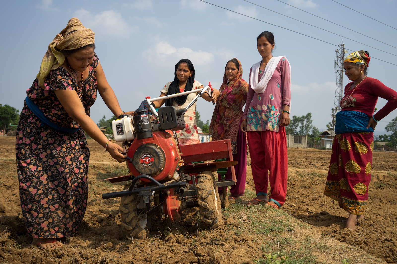 Women use a mini-tiller for direct seeding in Ramghat, Surkhet, Nepal. (Photo: P. Lowe/CIMMYT)