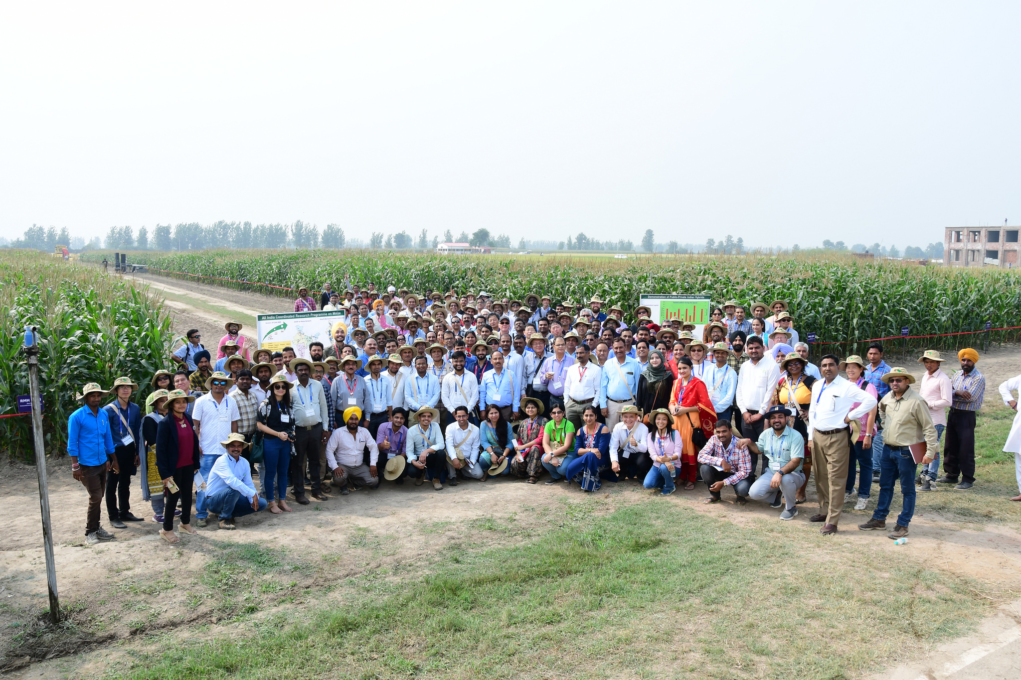 Conference participants pose for a group photo at the field visit site during the 13th Asian Maize Conference. (Photo: Manjit Singh/Punjab Agricultural University)