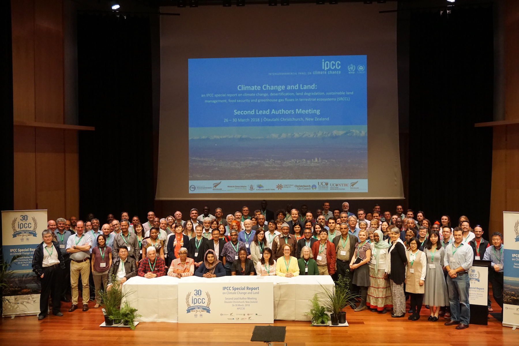 Tek Sapkota (center) stands for a group photo with other scientists working on the IPCC’s special report on climate change and land, at the second lead author meeting in Christchurch, New Zealand, in March 2018.