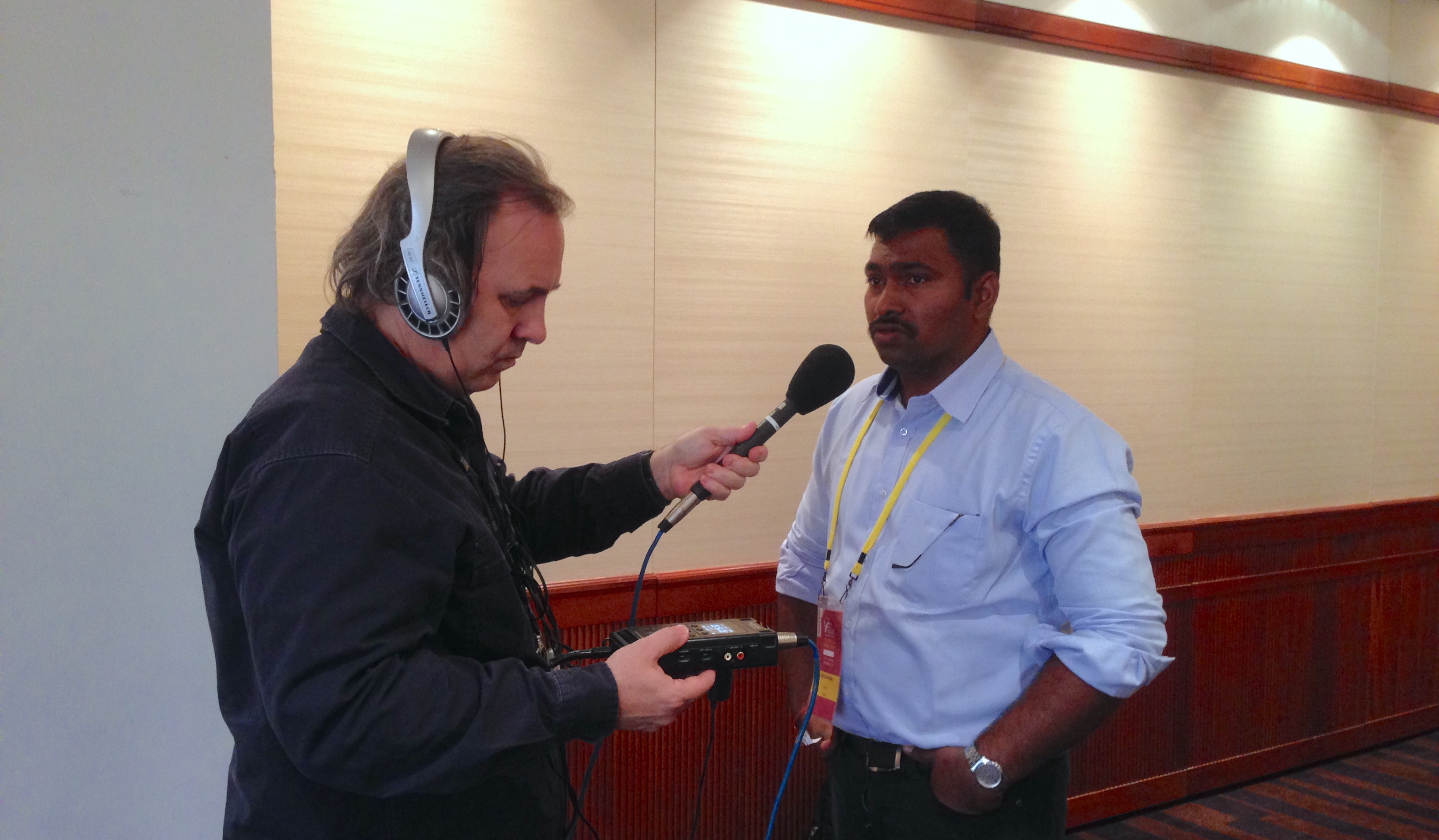 CIMMYT scientist Velu Govindan (right) is interviewed by Michael Condon of ABC Rural at the International Wheat Conference in Sydney, Australia, 2015. (Photo: Julie Mollins/CIMMYT)