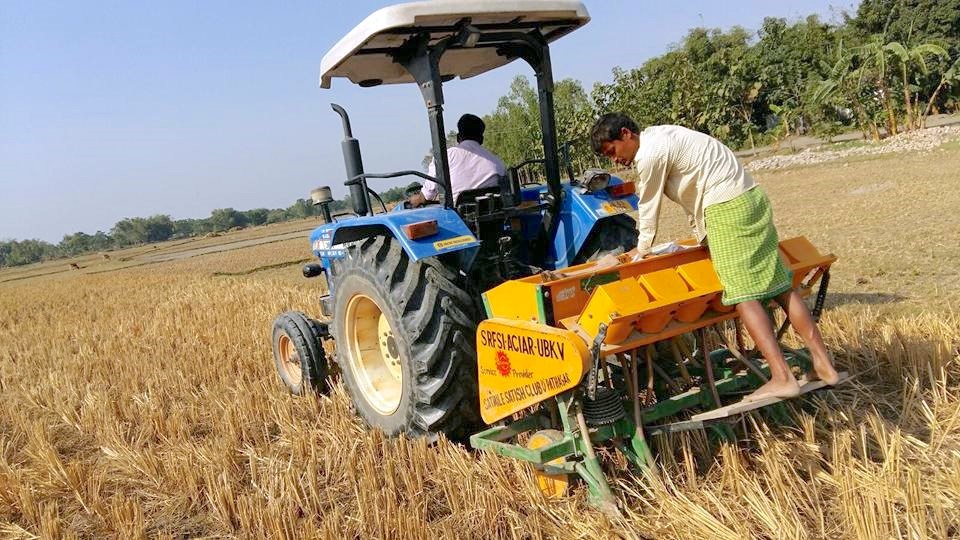 A zero-tillage multi-crop planter at work in West Bengal.