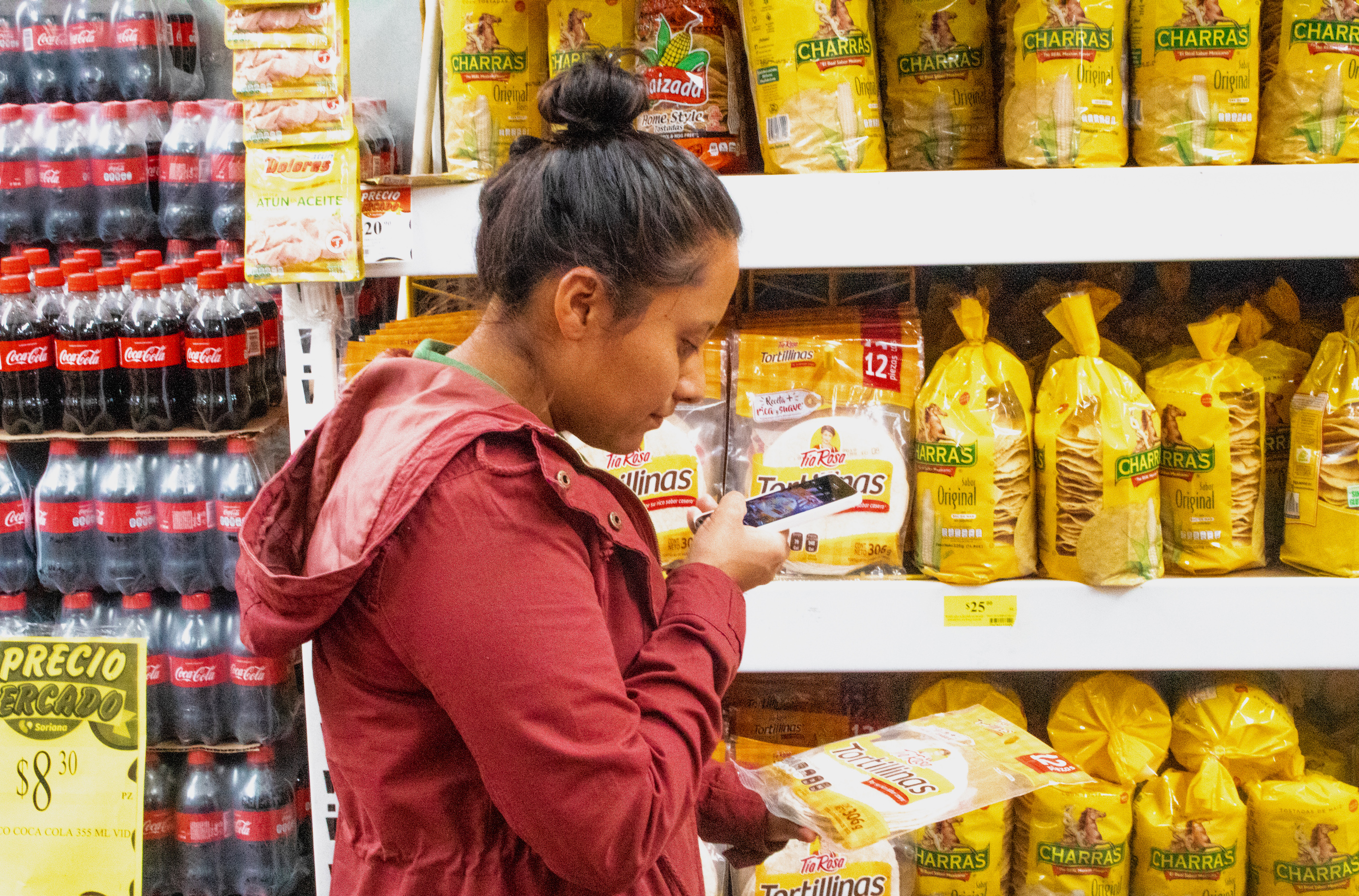 A researcher captures nutritional information from a packet of tortillas. (Photo: Emma Orchardson/CIMMYT)