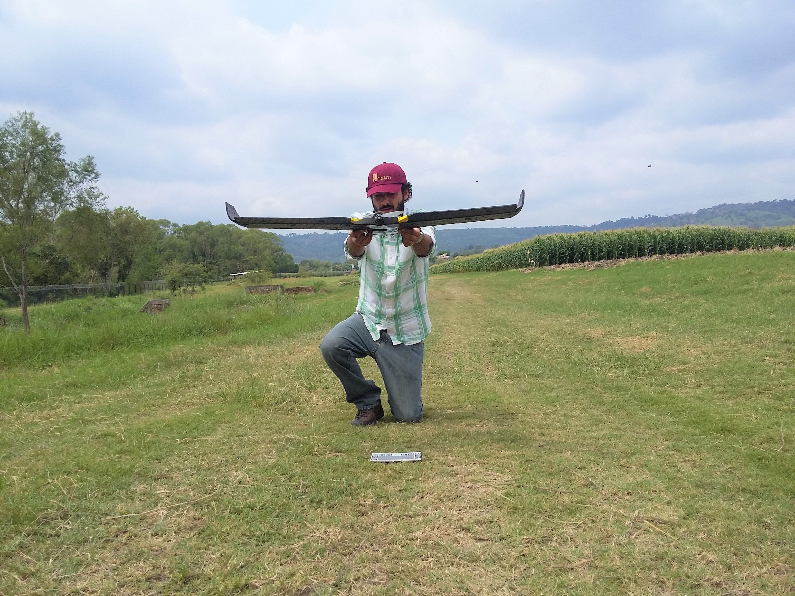 Francelino Rodrigues prepares an UAV for radiometric calibration for multispectral flight over a maize tar spot complex screening trial at CIMMYT’s Agua Fría experimental station, Mexico. (Photo: Alexander Loladze/CIMMYT)