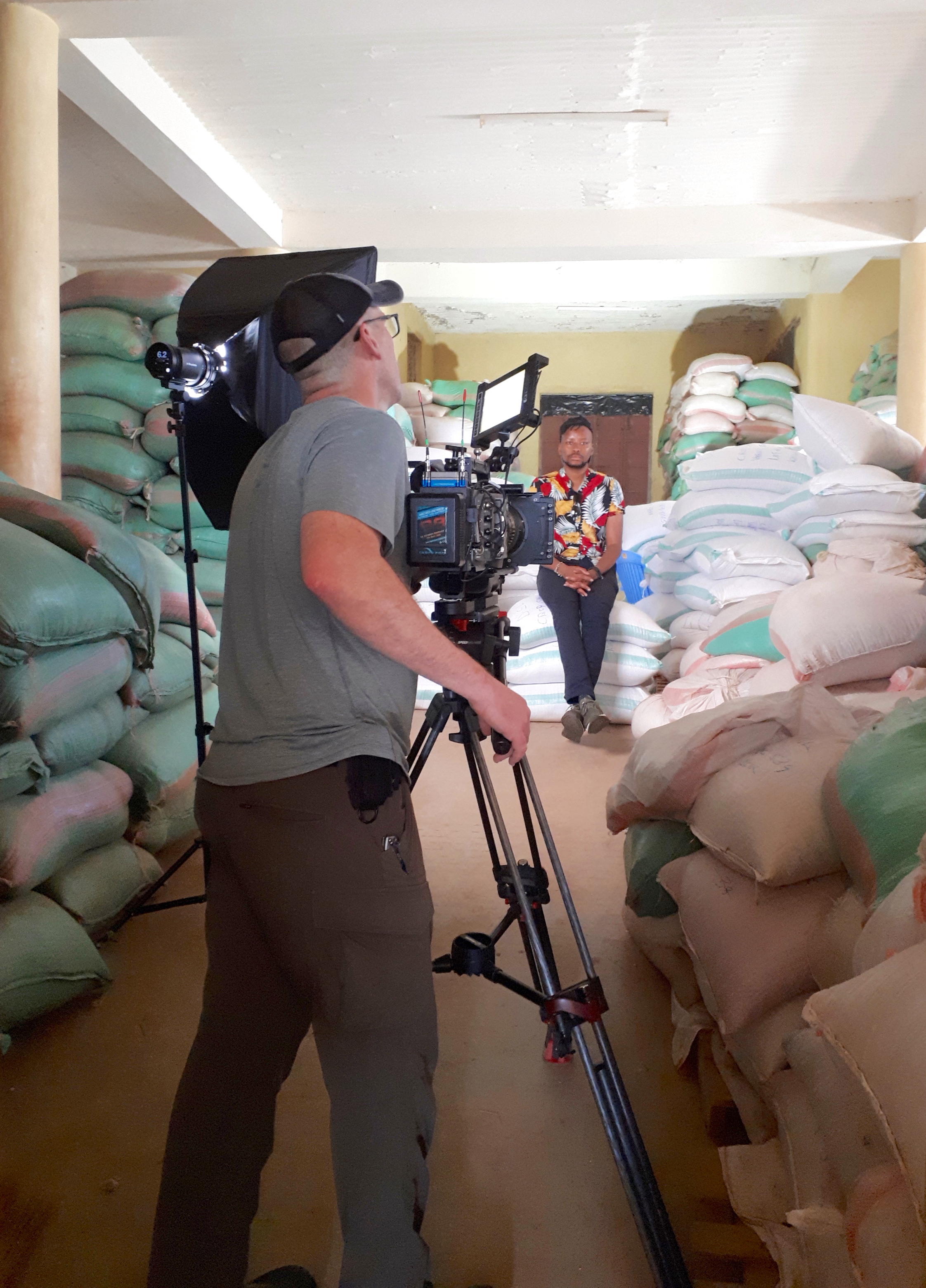 The video crew films and interview in a seed storage room. (Photo: Jerome Bossuet/CIMMYT)