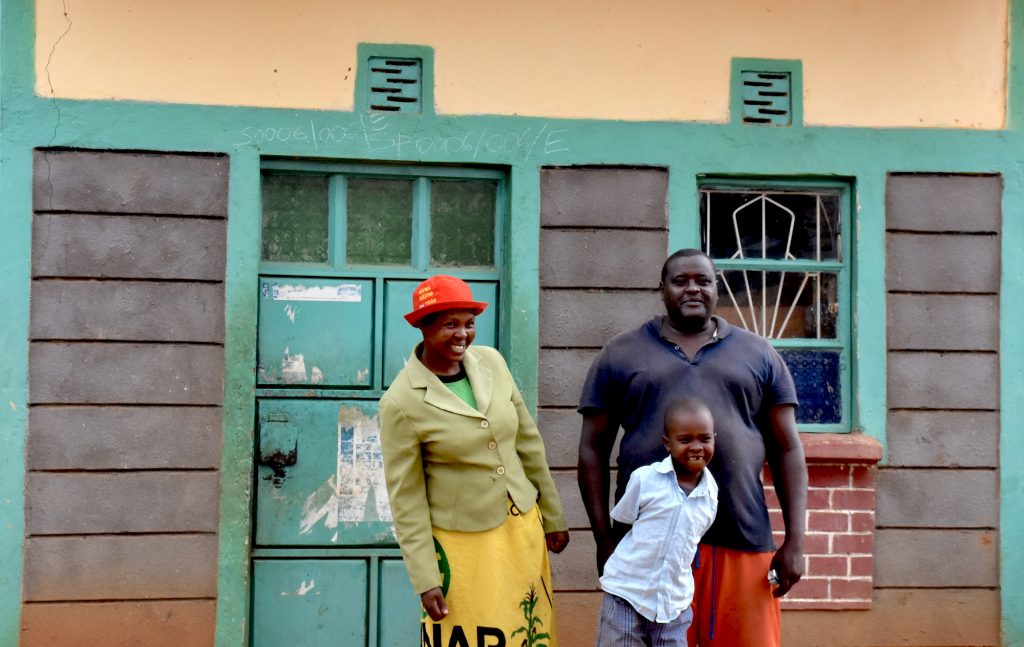 Ruth Kanini Somba (left) stands for a portrait with her husband Alex and their 8-year-old son. (Photo: Jerome Bossuet/CIMMYT)