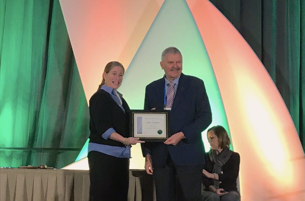 Alex Morgunov (center) receives his Crop Science Society of America Fellow certificate. (Photo: Johanna Franziska Braun/CIMMYT)