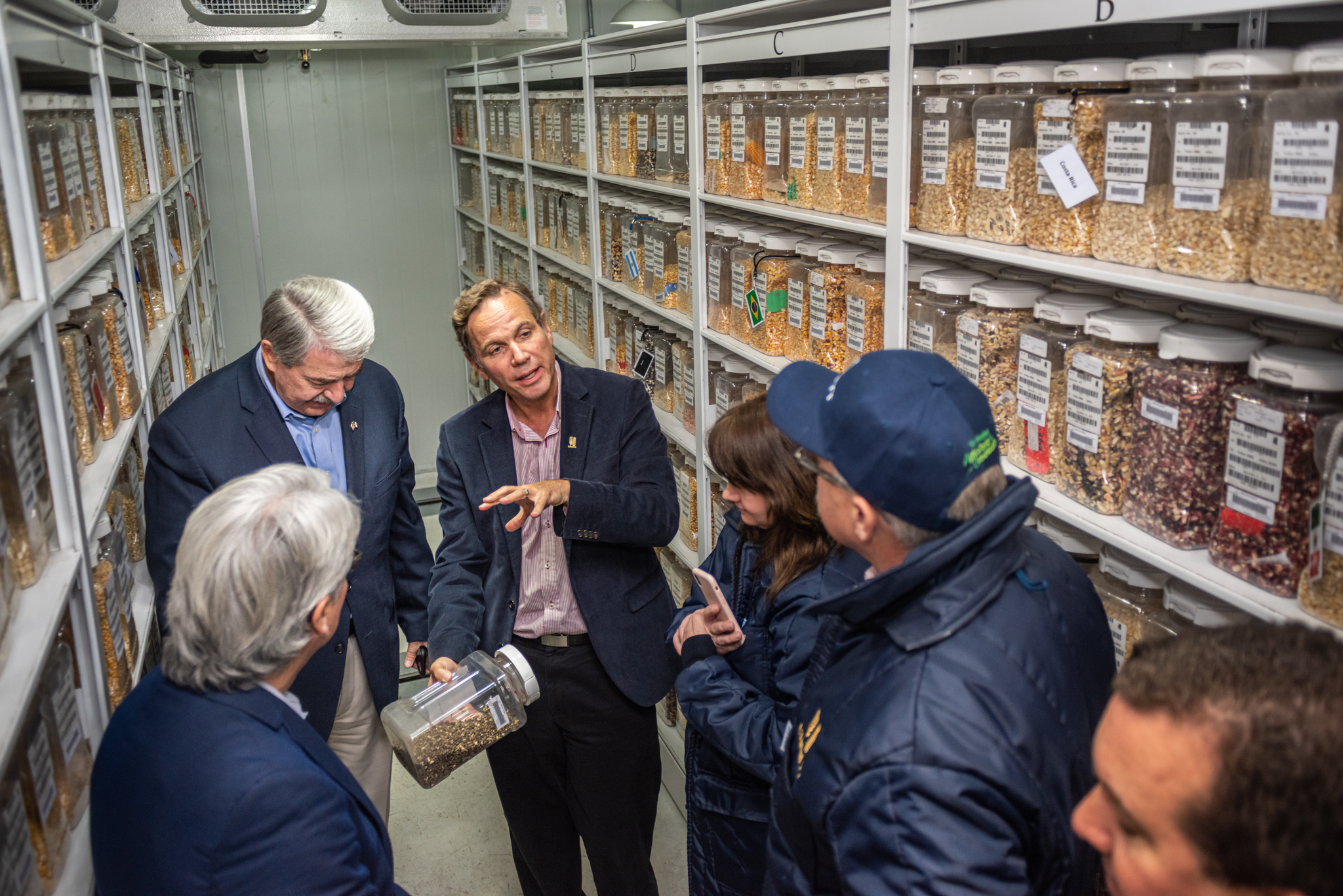 The director of the Genetic Resources program, Kevin Pixley (center), shows some of the genetic materials at CIMMYT's Germplasm Bank to US Under Secretary McKinney (top-left). (Photo: Eleusis Llanderal/CIMMYT)