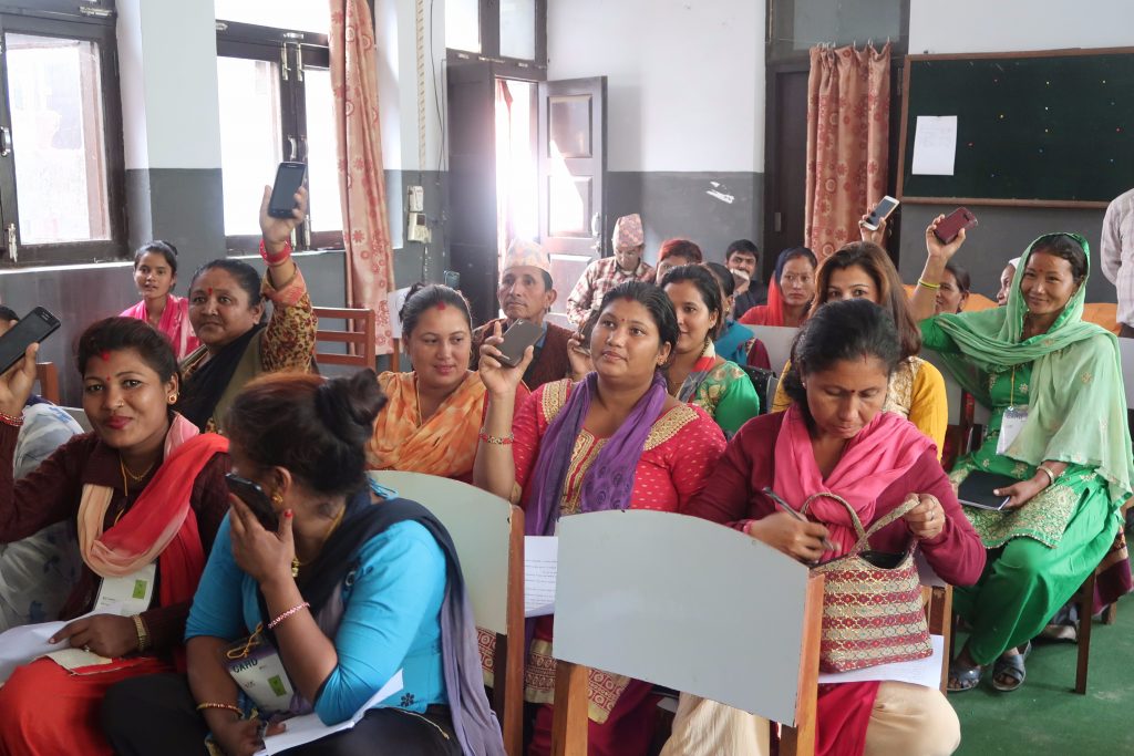 Farmers in Nepal show their most popular digital tool, a mobile phone, during a training. (Photo: Bandana Pradhan/CIMMYT)