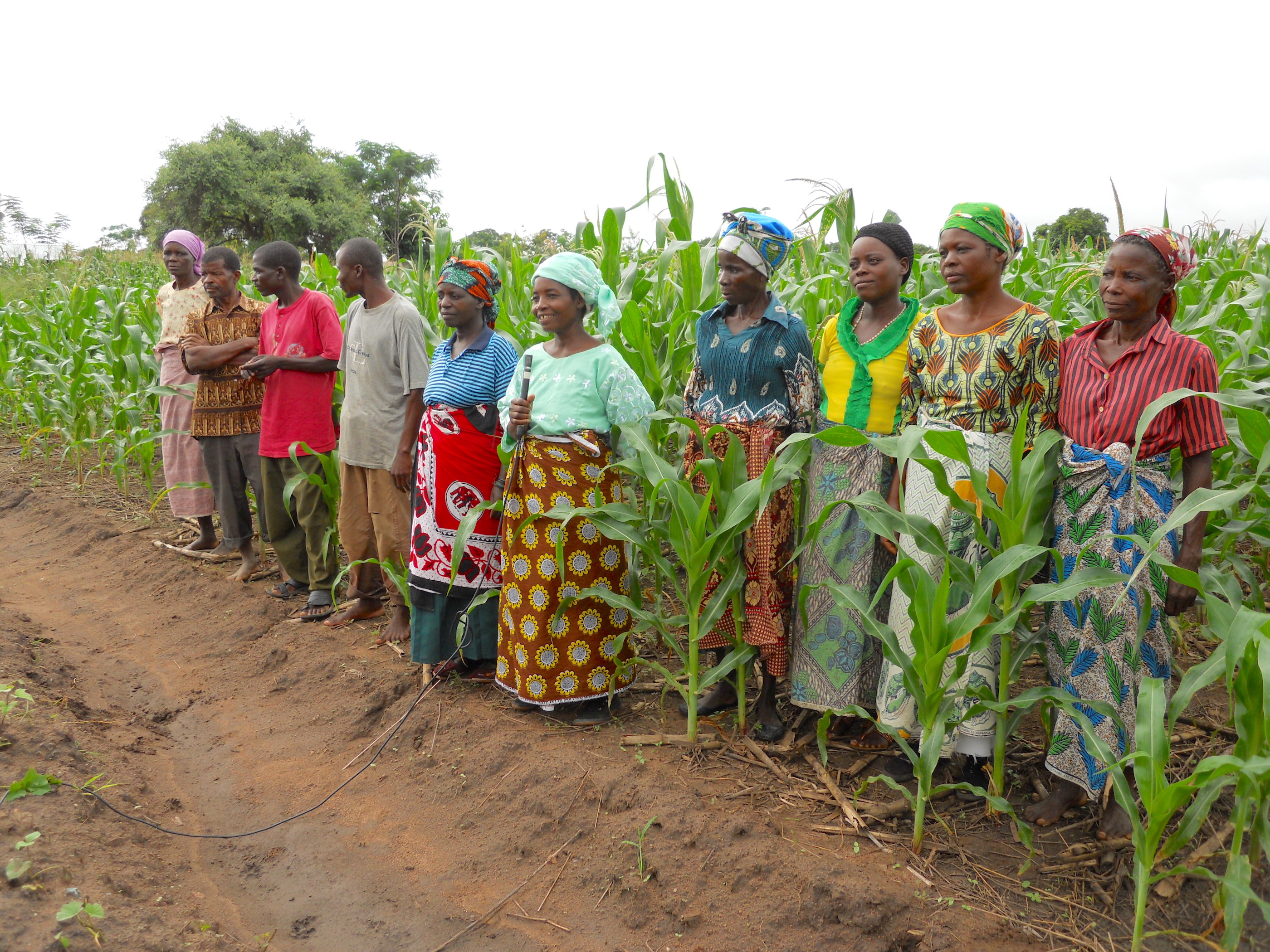 Luganu Mwangonde (center, holding a microphone) shares her experience in climate-smart agriculture to inspire the next generation of farmers in Malula, Balaka District, Malawi.