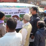 Farmers listen to information about fall armyworm displayed on an auto-rickshaw in Nepal’s Banke district. (Photo: Darbin Joshi/CIMMYT)