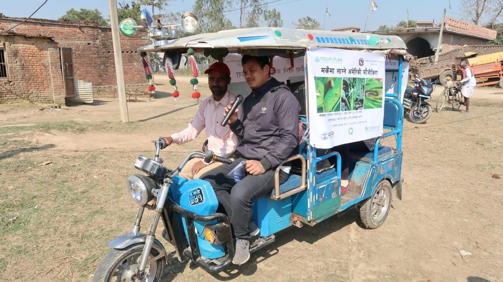 Outreach workers use an auto-rickshaw equipped with a sound system and infographics to disseminate information about armyworm in Nepal’s Banke district. (Photo: Darbin Joshi/CIMMYT.)