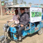 Outreach workers use an auto-rickshaw equipped with a sound system and infographics to disseminate information about armyworm in Nepal’s Banke district. (Photo: Darbin Joshi/CIMMYT.)