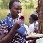 Participants were asked to rate the smell of different maize varieties, cooked as ugali, at a sensory evaluation in Kakamega County, Kenya. (Photo: Joshua Masinde/CIMMYT)