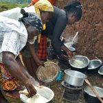 Cooks prepare ugali, or maize flour porridge, with different maize varieties at a sensory evaluation in Kakamega County, Kenya. (Photo: Joshua Masinde/CIMMYT)