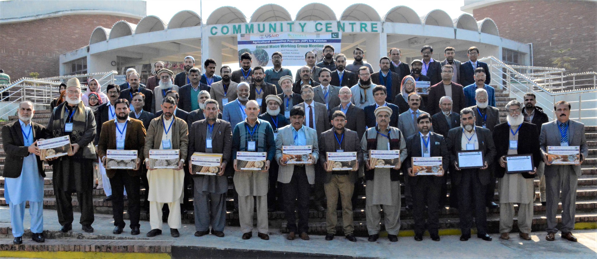 Participants at a February 2020 maize working group meeting of the Pakistan Agricultural Innovation Program (AIP) with seed of maize parental lines shared by CIMMYT. (Photo: Awais Yaqub)