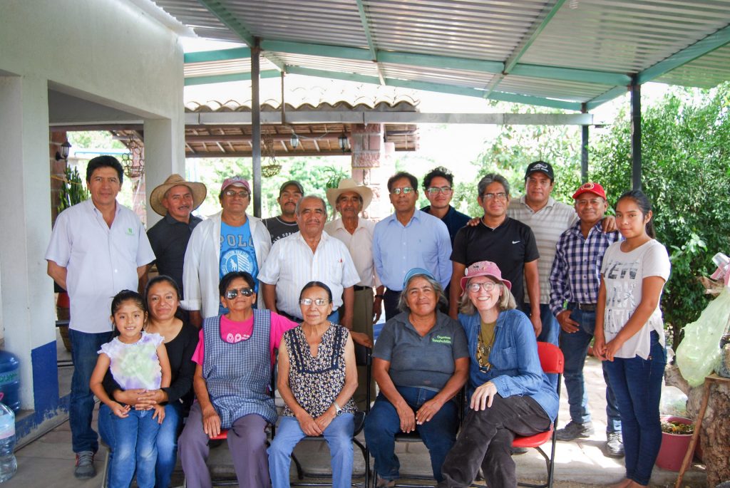 Denise Costich (front right, sitting) poses for a photo with Tonahuixtla residents and members of the Totomoxtle project. (Photo: Provided by Denise Costich/CIMMYT)