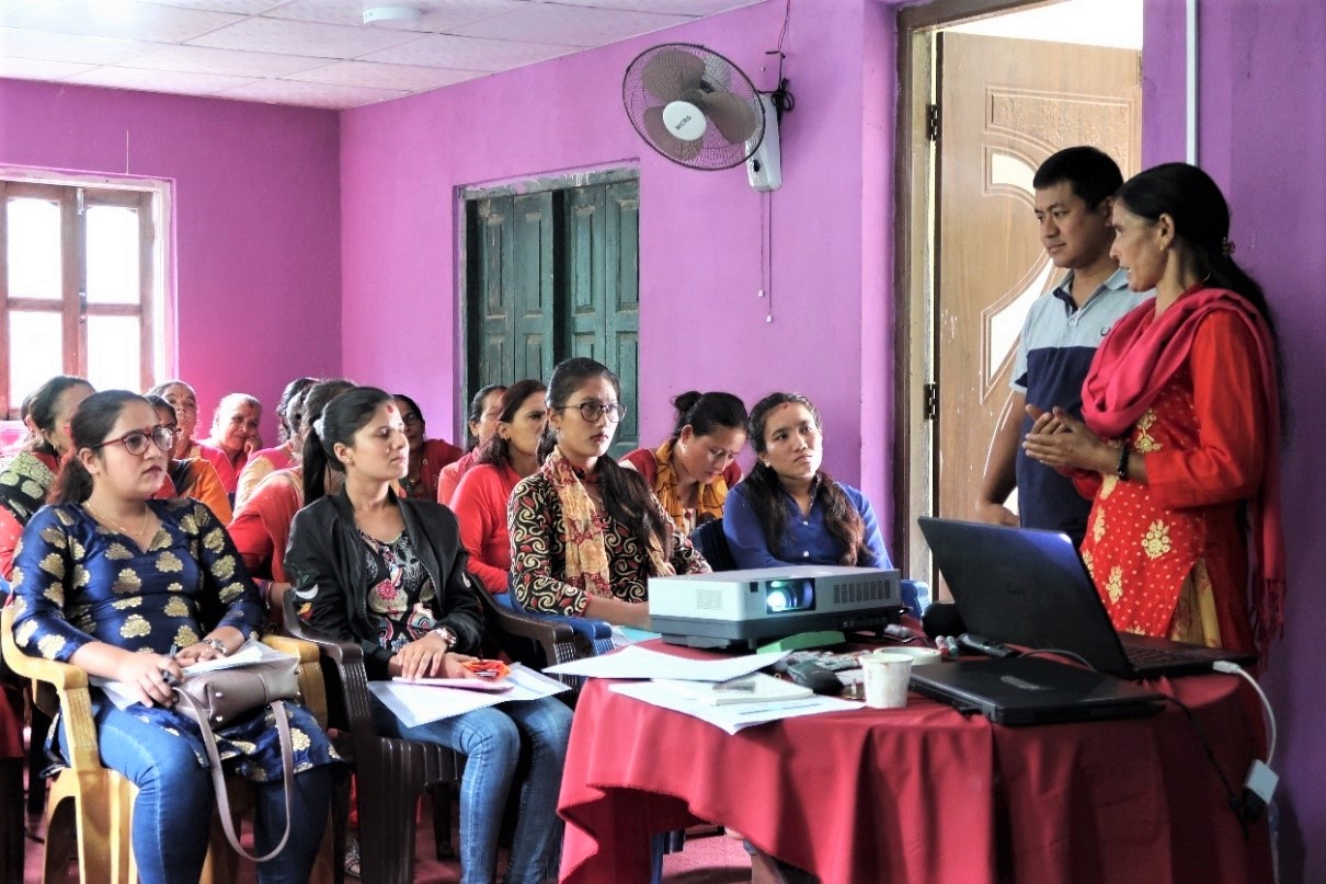 Lead farmer Parbati Gautam shares her experiences on seed production of maize hybrid at a training event.