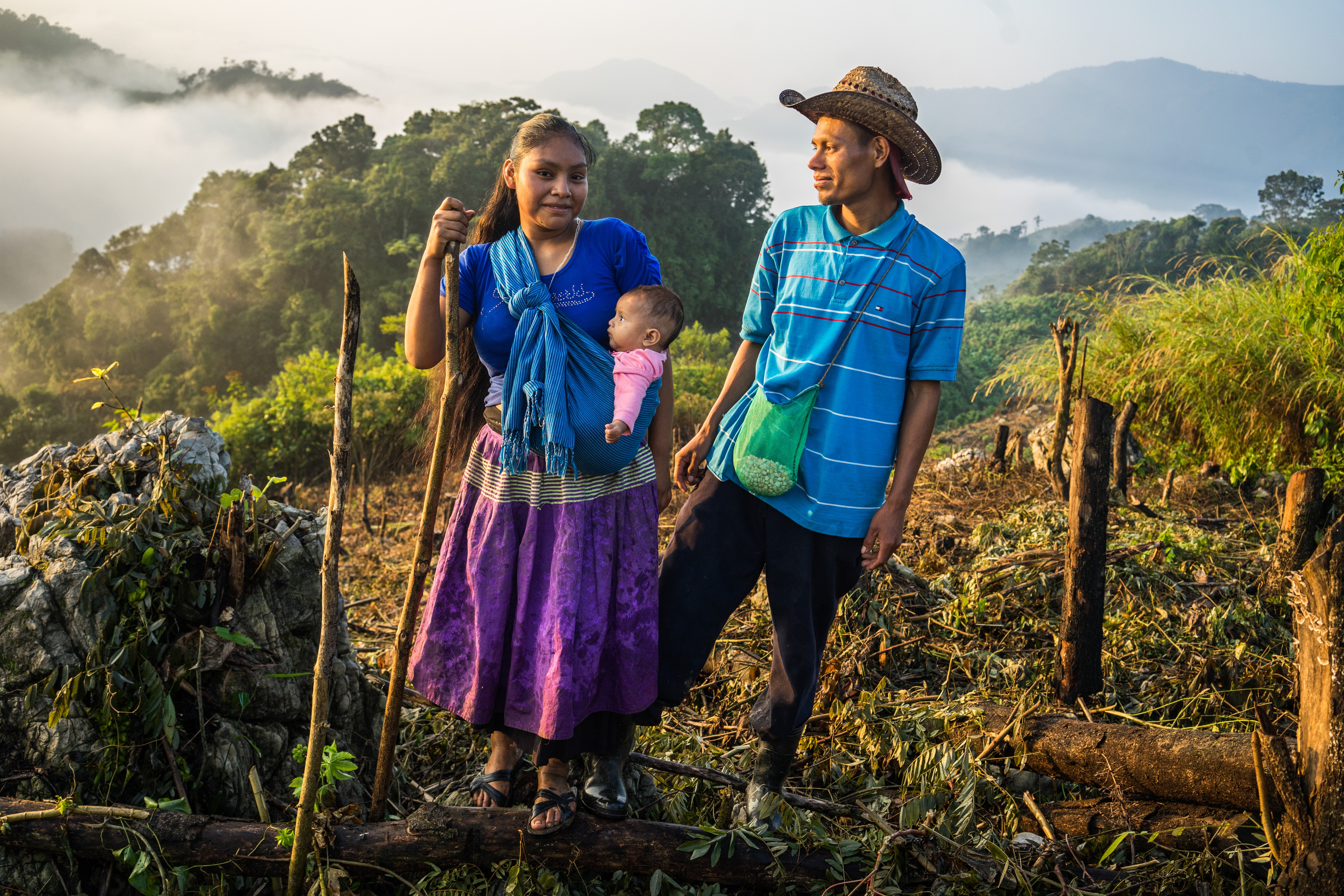 Woman and man in maize field.