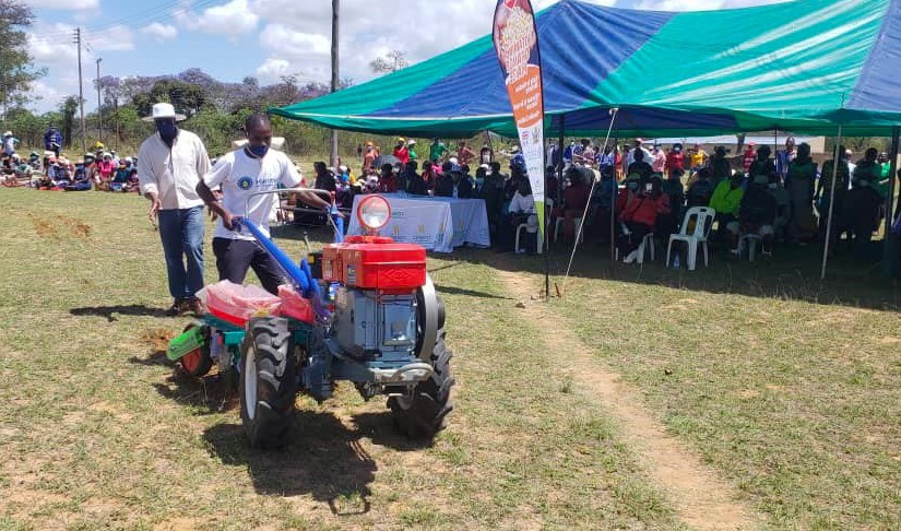 Representatives from Kurima machinery conduct a demonstration of the two-wheel tractor during the seed fair in Masvingo, Zimbabwe. (Photo: Shiela Chikulo/CIMMYT)