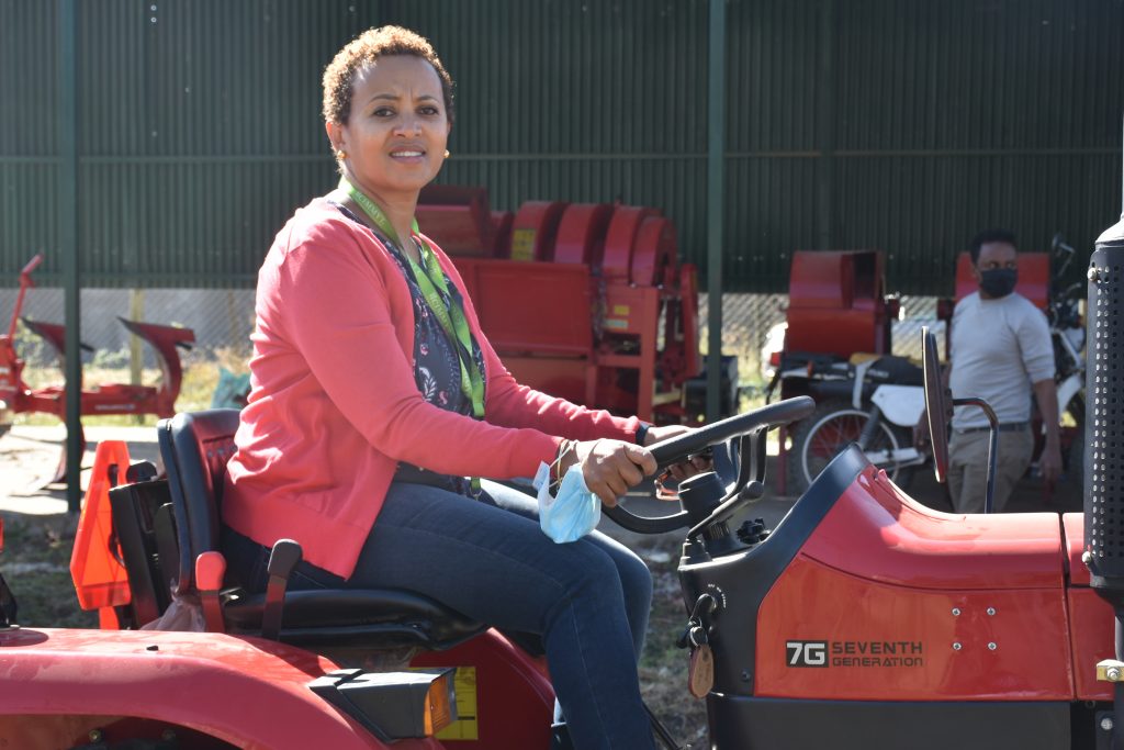 Rahel Assefa tests out farm machinery in Addis Ababa, Ethiopia. (Photo: Simret Yasabu/CIMMYT)