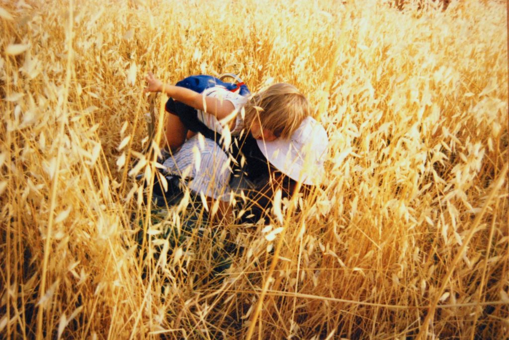 Denise Costich in Spain in 1986, doing fieldwork on Ecballium elaterium with her daughter Mara.