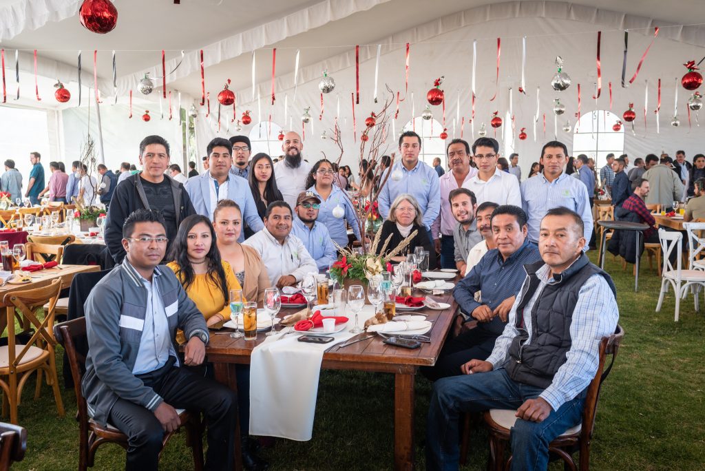 Costich and the Maize Collection team at the 2018 CIMMYT Christmas party. Filippo Guzzon, seated to the right of Costich, had just been offered a postdoc with the team.