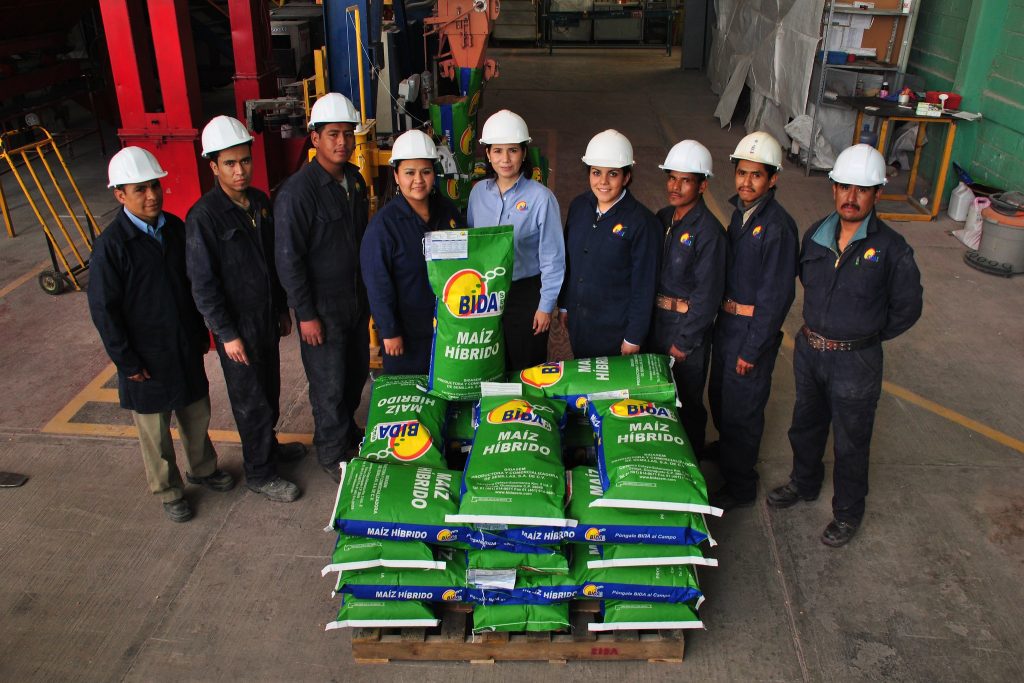 Bidasem director general María Ester Rivas (center) stands for a photo with her seed processing team. Bidasem is a small seed company based in the city of Celaya in the central Mexican plains region known as the Bajío. Despite their small size, Bidasem and similar companies play an important role in reaching small farmers with improved seed that offers them better livelihoods. (Photo: X. Fonseca/CIMMYT)