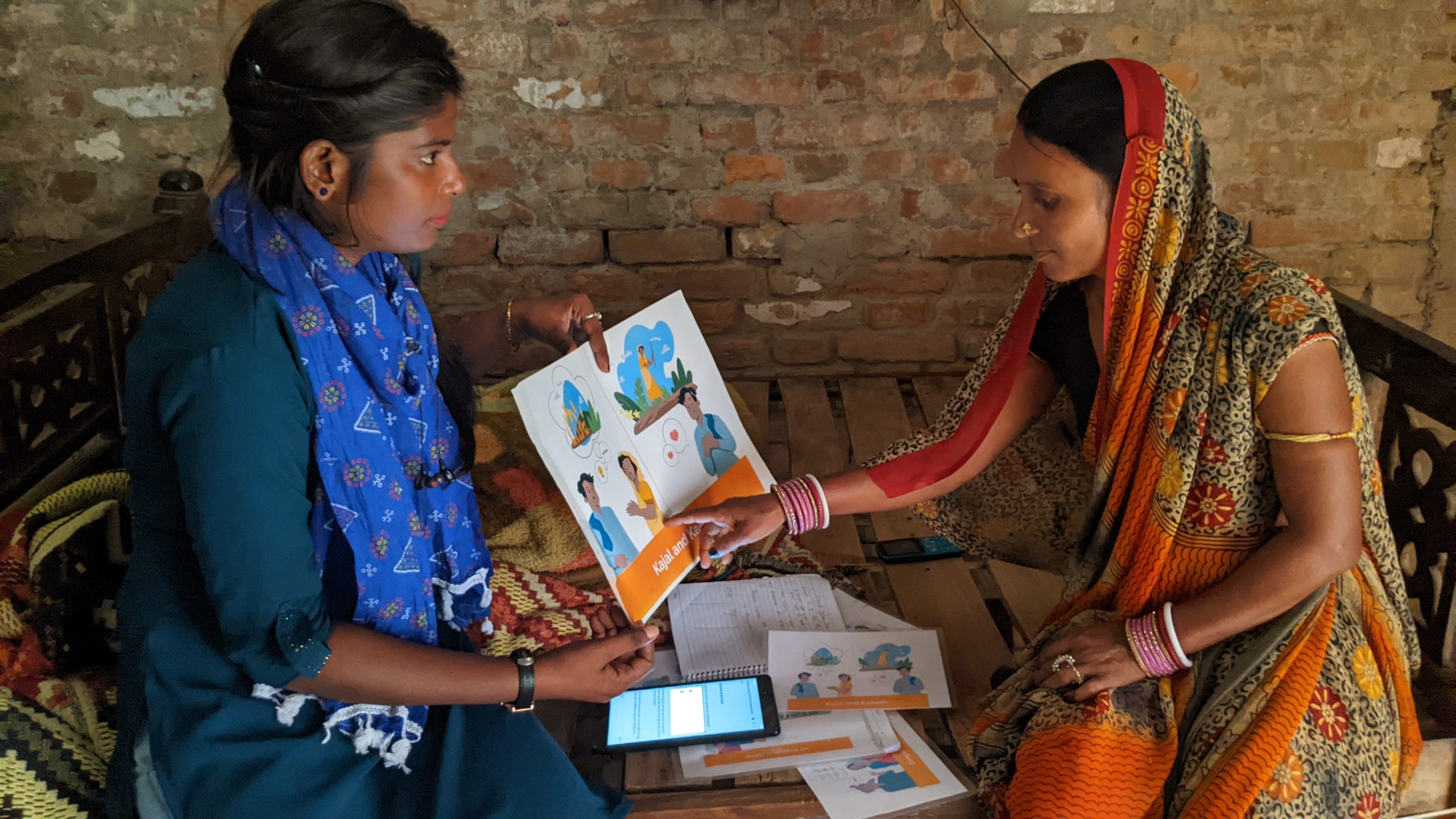 Farmer Devi points at the vignette that aligns with her household decision-making process. (Photo: Nima Chodon /CIMMYT)