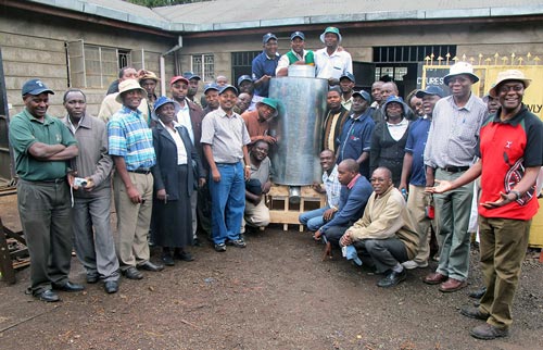 Delegates stand with a modified metal silo at a workshop at the Baraka Agricultural College in Molo, Nakuru County, Kenya. Photos: Wandera Ojanji/CIMMYT