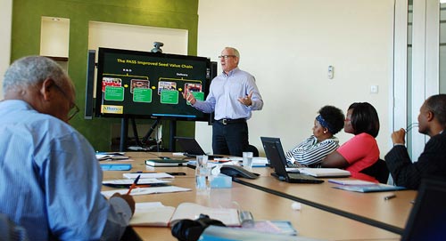 DTMA project leader Tsedeke Abate takes notes as AGRA-PASS director Joseph DeVries’ makes his presentation. Photo: Florence Sipalla/CIMMYT