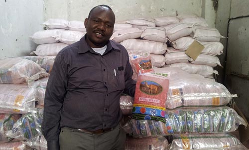 Watanga Chacha, CEO Meru Agro displays a bag of HB513, a fertilizer-friendly maize hybrid. Picture: Biswanath Das/CIMMYT