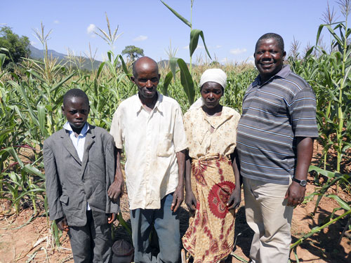 IIAM researcher David Mariote (right) with farmers of Manica Province, Mozambique.