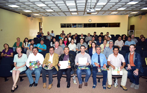 GCAP International Training Course on Conservation Agriculture (CA) graduates hold certificates, which authorize them to teach and train others on CA practices, during the Course’s closing ceremony. Photo: CIMMYT