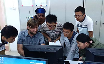 Carl Timler, Wageningen University, assists Gansu University postgraduate students during the Farm DESIGN training activity. Photo: Jack McHugh/CIMMYT