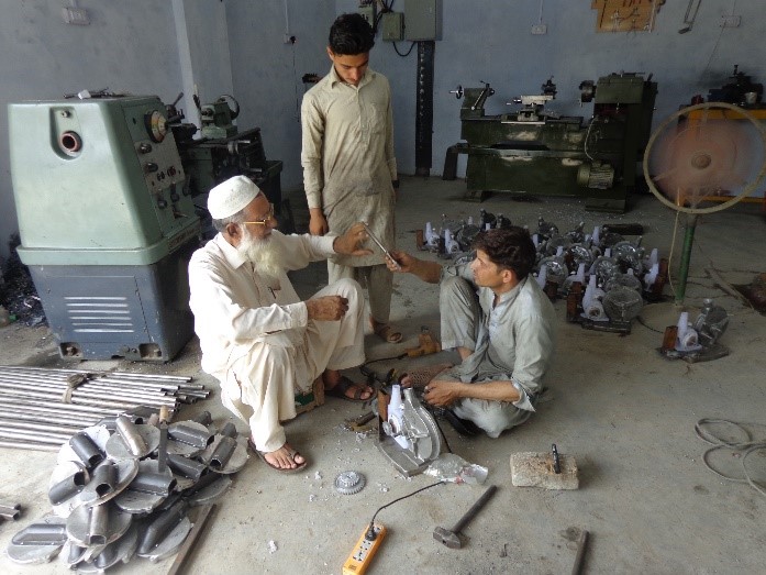 Ameer Sani, a local manufacturer, produces push row planters in his workshop in Mardan. Photo: CIMMYT