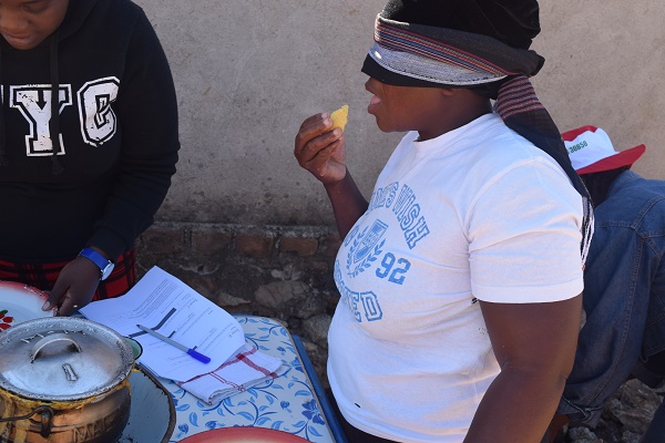 Blindfolded farmer takes part in the taste evaluation exercise. R. Lunduka/CIMMYT