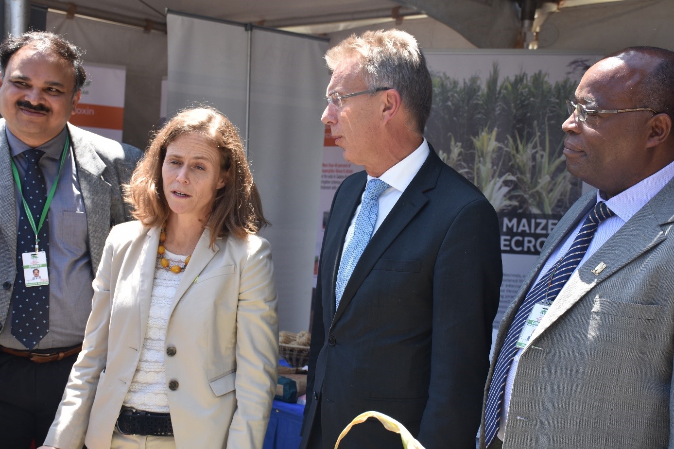 B.M. Prasanna, Martin Kropff and Stephen Mugo brief Beth Dunford, assistant to the administrator of USAID’s Bureau for Food Security, on CIMMYT’s work at a KALRO/USAID event during AGRF. Photo: B. Wawa/CIMMYT