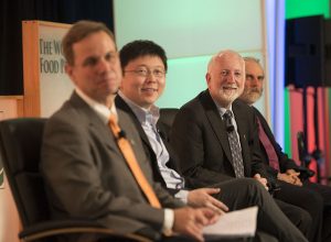 Speakers on panel "How Can CRISPR-Cas Technology Assist Small Holder Farmers Around the World?" at the 2017 Borlaug Dialogue in Des Moines Iowa. L-R: Kevin Pixley, leader of the Seeds of Discovery project and the Genetic Resources Program at CIMMYT; Feng Zhang, core member of Broad Institute; Neal Gutterson, a member of CIMMYT’s board of trustees and vice president of research and development at DuPont Pioneer, part of the agriculture division at DowDuPont; Nigel Taylor, interim director of the Institute for International Crop Improvement at Donald Danforth Plant Science Center. Picture credit: World Food Prize