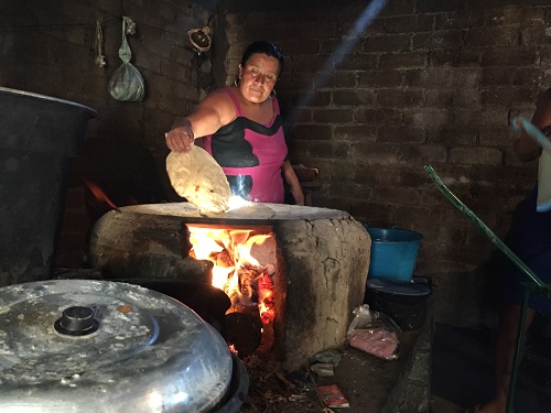 A Chatino woman makes extra-large tortillas, prized in local markets, using native maize. Photo: Matthew O'Leary