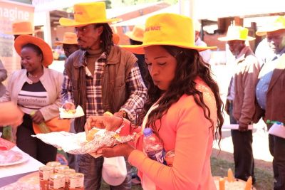 Food industry representatives taste test foods made with vitamin A orange maize at an open day. Photo: Matthew O'Leary/ CIMMYT
