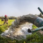 A farmer in Bangladesh irrigates his land using an axial-flow pump. (Photo: Ranak Martin)