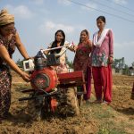 Women farmers in Nepal use a mini tiller for direct seeding. (Photo: P.Lowe/CIMMYT)
