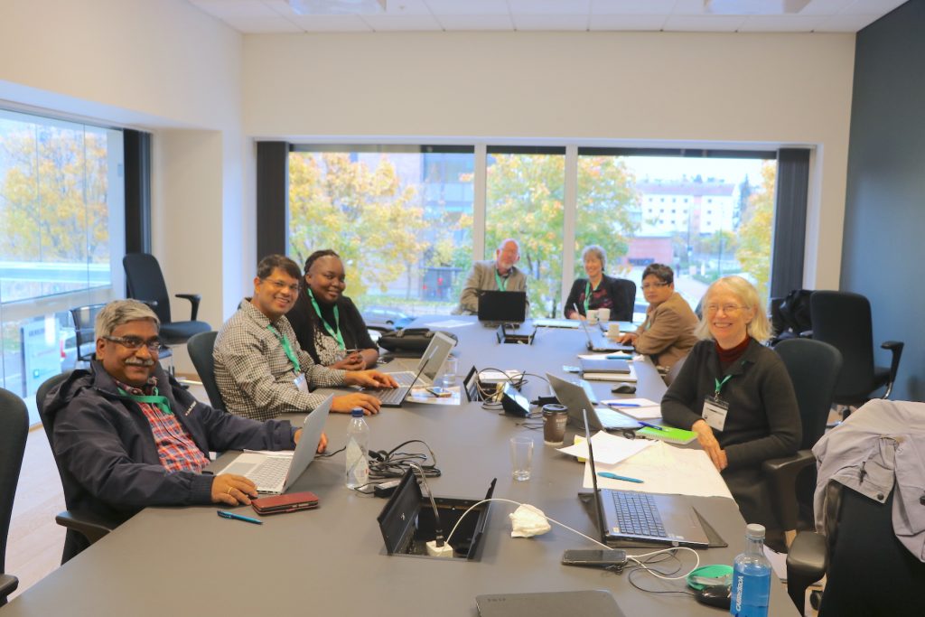 Tek Sapkota (second from left) and other scientists participate in a small group session during a meeting of lead authors of the Intergovernmental Panel on Climate Change (IPCC).